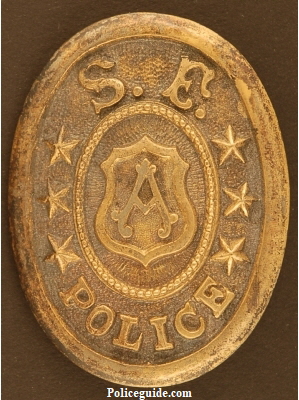 Early San Francisco Police custom die belt buckle and pictured to the right is Lt. Frederick Esola wearing a similar buckle.