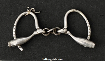 Henry Gaylord’s nickel plated handcuffs hallmarked Marlin Firearms Company, with key.