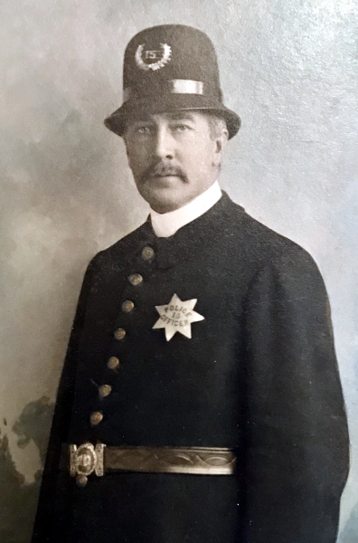 San Jose Police officer H. T. Plummer wearing badge #15.