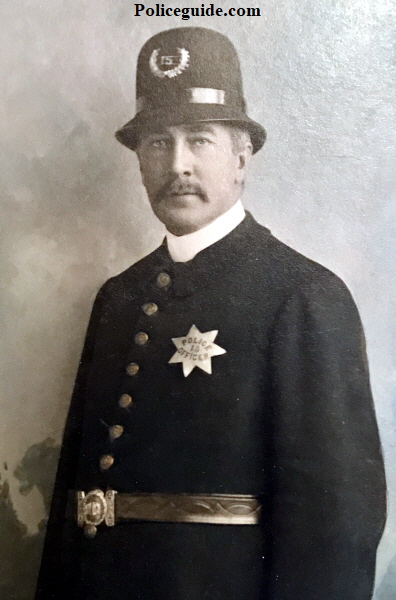 San Jose Police officer H. T. Plummer wearing badge #15.