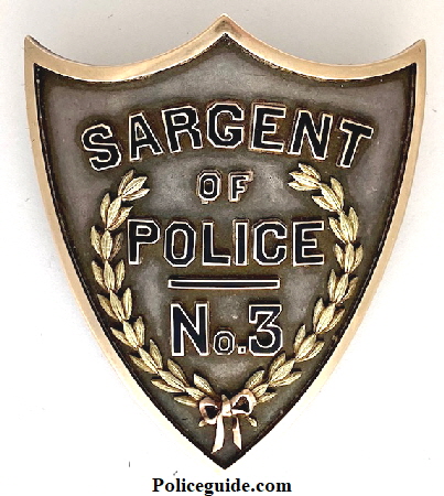 Sargent (German Spelling) of Police No. 3 St. Louis, MO Police Dept.  Made of sterling & gold.  Presented to Sgt. Anderson T. Shipp.