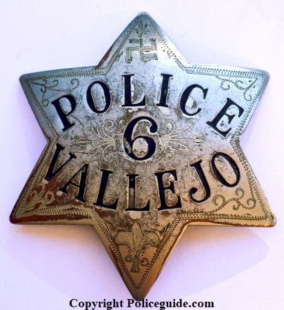 1st issue Vallejo Police star No. 6 with hand engraved scrolling and a “Good Luck Swastika” in the top point.