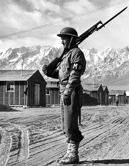 Soldier at California Manzanar Internment Camp with MP arm band.