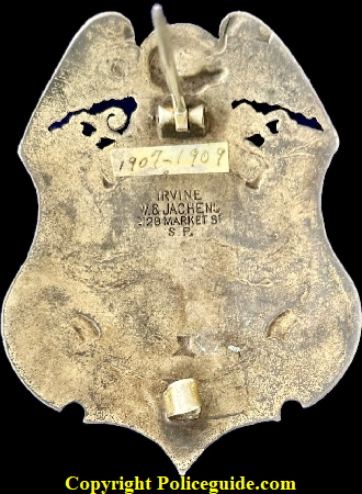United States Indian Service Special Officer, sterling silver, eagle top shield adorned with three semi precious stones.  Hallmarked Irvine W. & Jachens 2129 Market St. S.F.  This mark was used from 1907-1909.