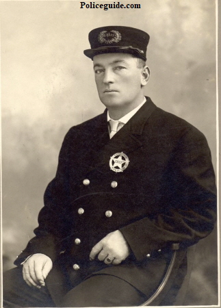 Vancouver, WA Police Chief John Secrist wearing the badge on the left, circa 1908.